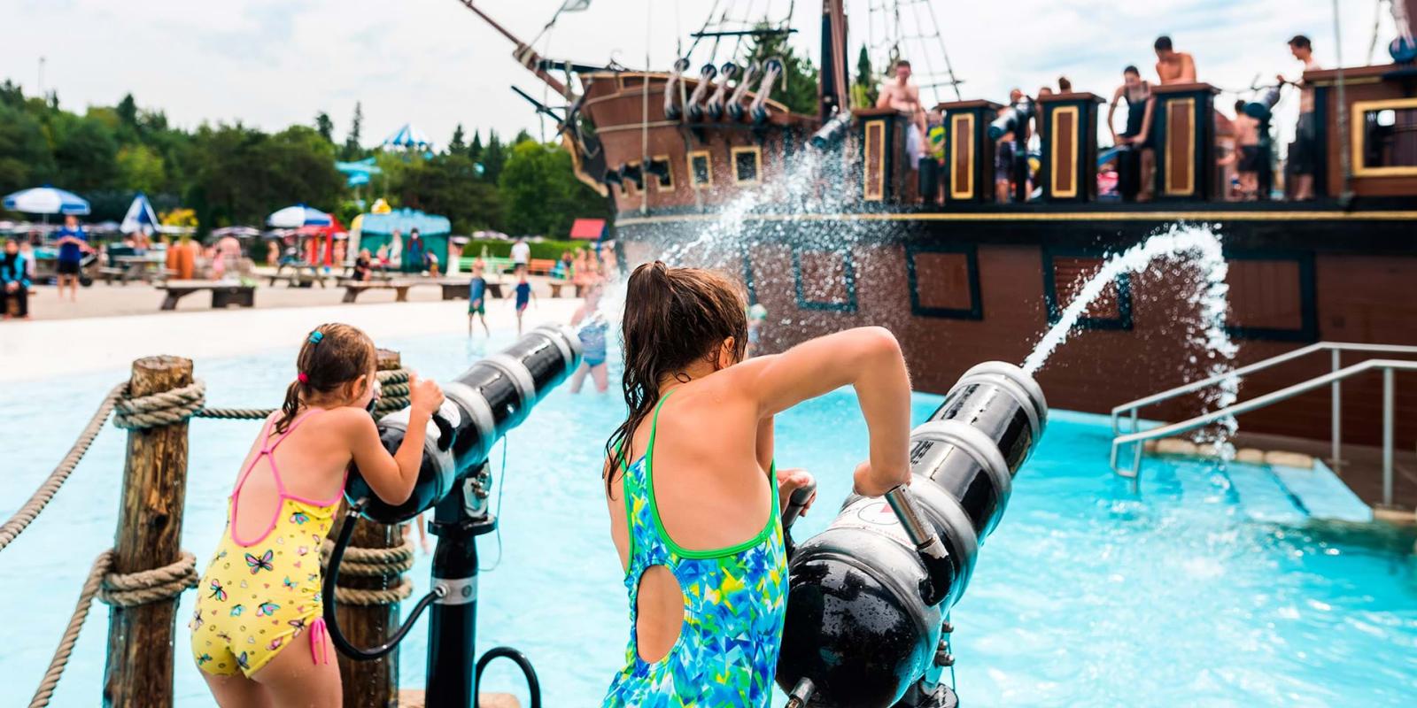 Children have fun in the water games and the pirate lair at Village Vacances Valcartier.