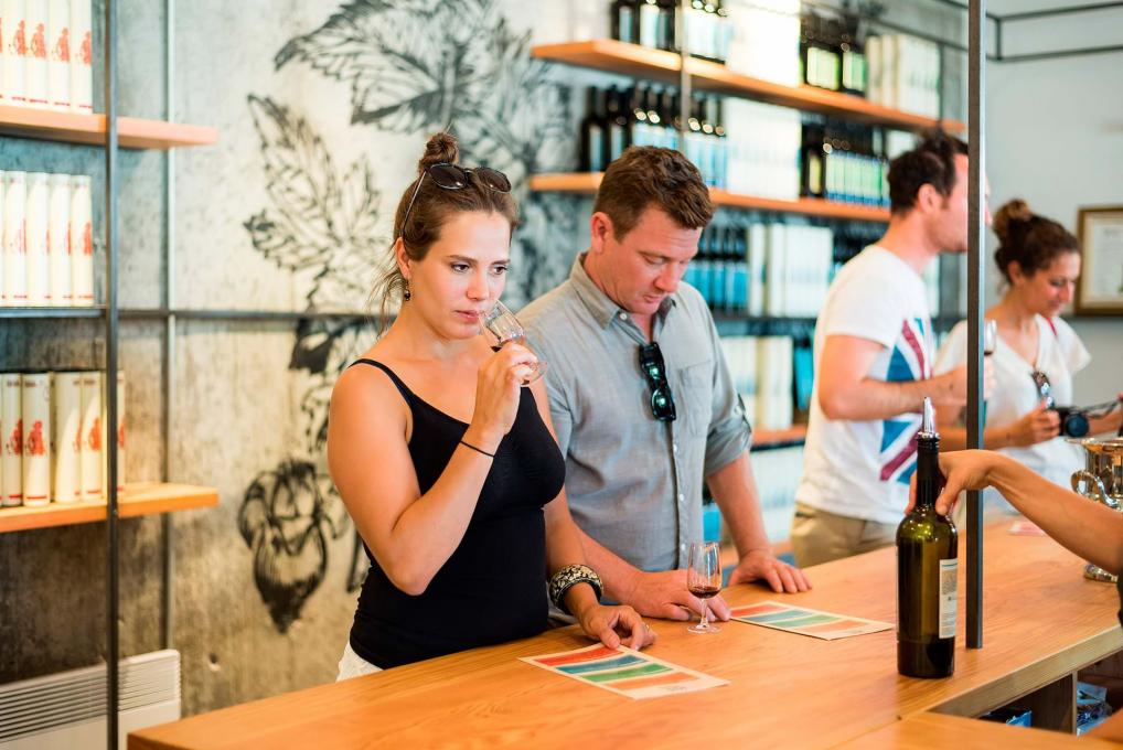 Customers participate in a wine tasting at a vineyard boutique on the Ile d'Orléans.