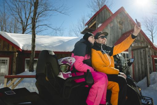 Au Chalet en Bois Rond - selfie of couple on snowmobile