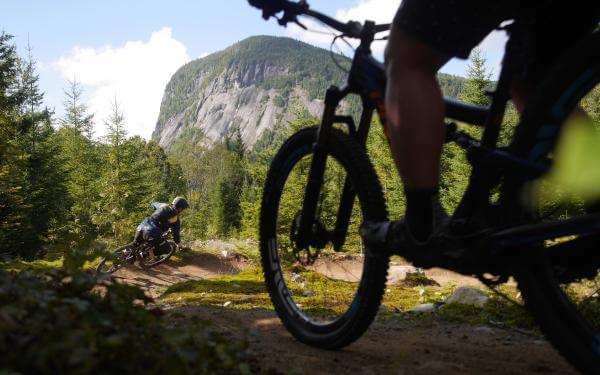 Cyclists on mountain bike trails in the Vallée Bras-du-Nord.